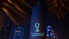 The Qatar 2022 World Cup logo projected onto Doha Tower